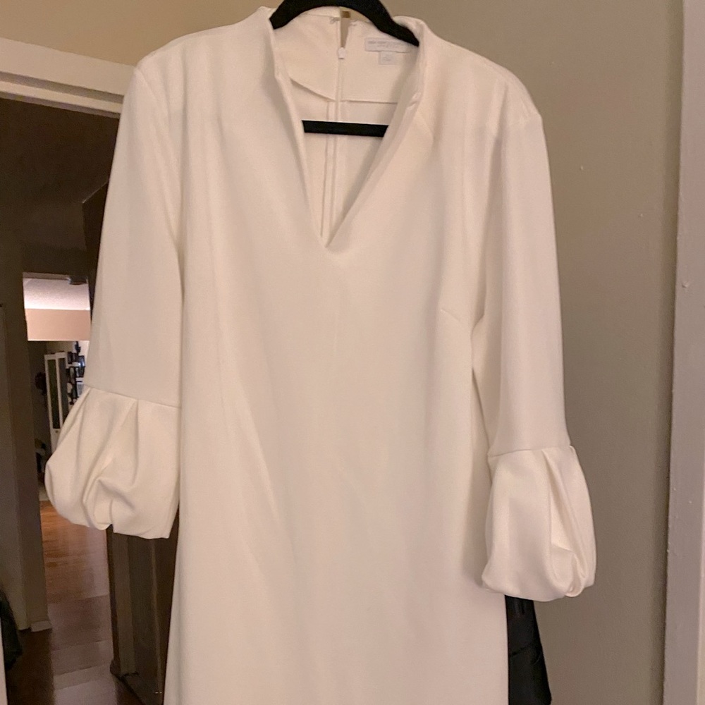 White dress balloon sleeve. Cocktail length. Knee length. Satin/ spandex/ rayon